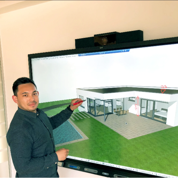 Owner of WachbergerBau, Werner Kopatsch, interacting with a 3D home rendering with a SMART 7086 series for business.