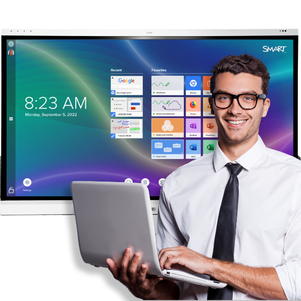 IT Manager – a young man with brown hair and glasses - standing in front of a SMART Board with a laptop in his hands.
