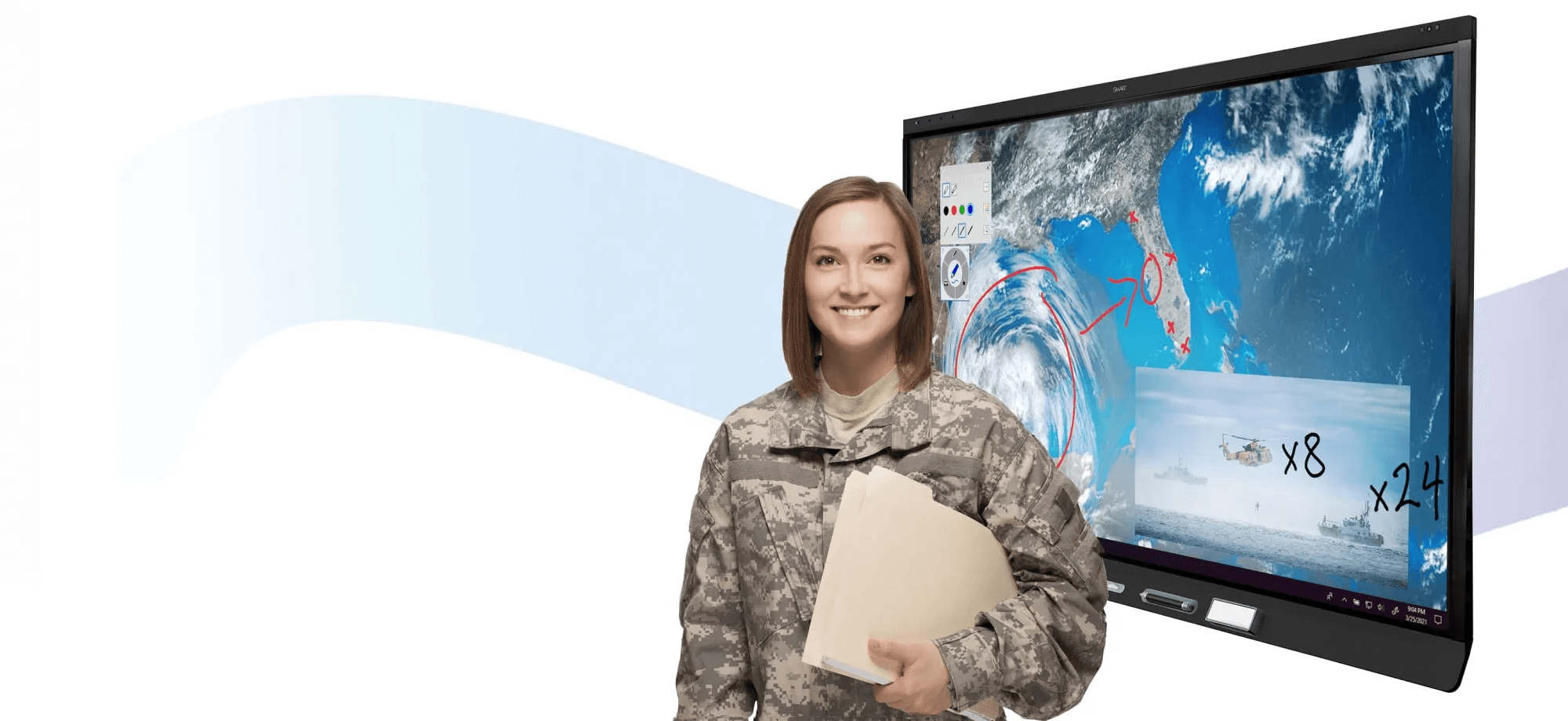 Woman in military uniform holding a folder stands beside a SMART interactive display showcasing satellite imagery of a cyclone, with various annotations and smaller images, including helicopters and ships.